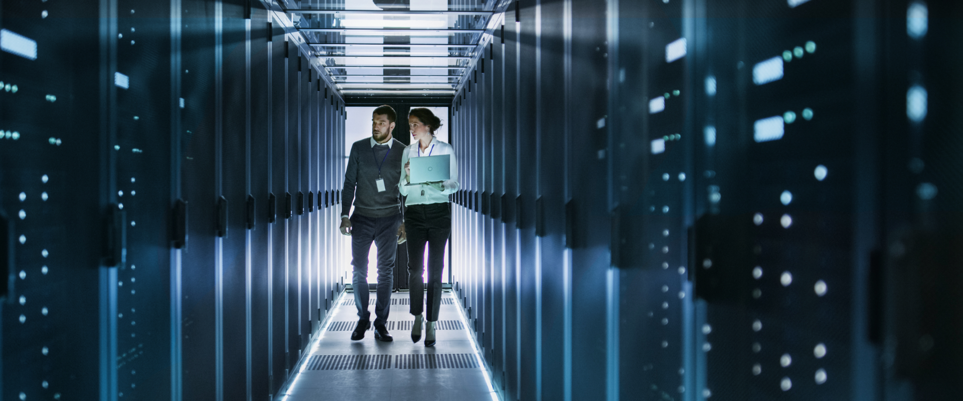 Man and woman walking server room